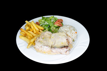 Lemon chicken with rice, salad and french fries in a white plate