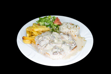 Mushroom chicken with rice, salad and french fries in a white plate