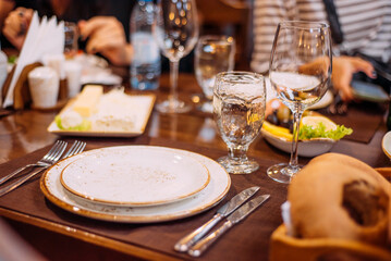 Laid table in the restaurant. Beautiful serving. Reserved table in the restaurant.