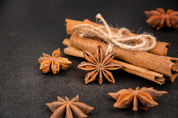 Cinnamon sticks and star anise on black background