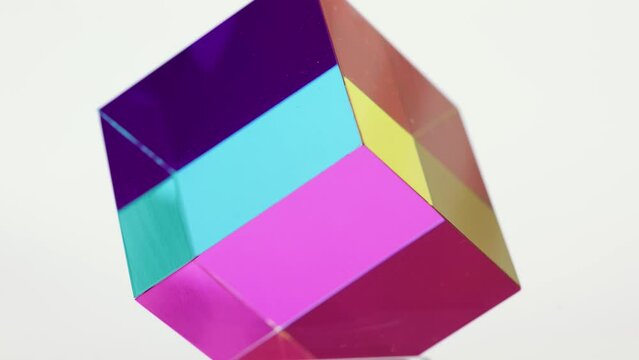 Edge of optical illusion colorful cube going out of focus