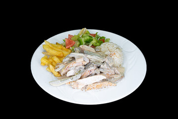 Creamy chicken with rice, salad and french fries in a white plate