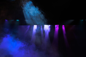 Theatrical scene without actors, scenic colorful light and smoke