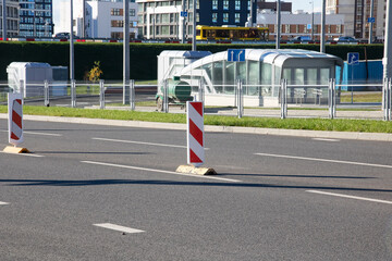 Striped road signs in middle of road