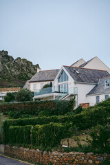 Fototapeta na wymiar Beautiful house on the coast of Jersey Island in UK, Channel Islands