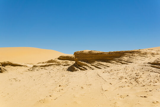 desert landscape, layered deposits in the sandy desert