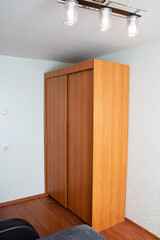 Fototapeta premium Wardrobe with sliding doors in the room