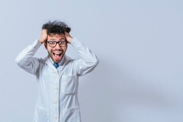 A mad scientist pulling his hair out on isolated background. Mad scientist grabbing his hair with a...