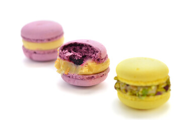 Delicious macaroons lie on a white tray.