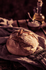 Homemade bread and cloth napkin at wood table. Bakery concept and bread on wooden tabletop