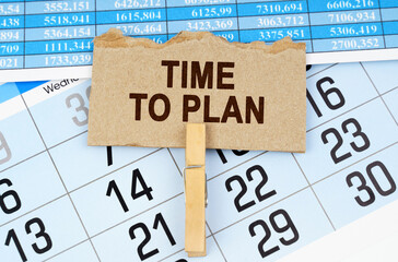 On the calendar and reporting documents is a cardboard plate with the inscription - TIME TO PLAN