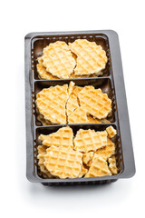 Broken round waffle in plastic pack isolated