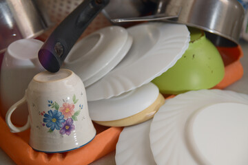 Dishes drying on a family kitchen bench after being washed by hand