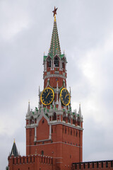 Spasskaya tower of the Kremlin on red square on cloudy day. Large clock and chimes on the Spasskaya tower. Moscow, Russia-September 22, 2022