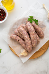 Top view of  barbeque sausage on packing paper and spice cooking food