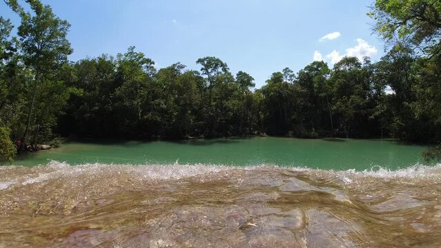 At the precipice of a waterfall in the jungle of Latin America (Cascadas Roberto Barrios Mexico)