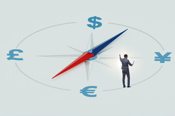 Fototapeta premium Businessman in currency trading concept with compass