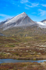 Canada, Yukon, view of the tundra in autumn, with mountains in background, beautiful landscape in a wild country
