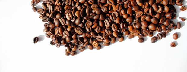 roasted coffee beans on white background with space for text, top view