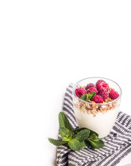 Homemade yogurt with raspberries and granola copy space.