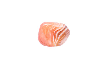 carnelian agate (sardonyx) macro detail white isolated background. close-up polished semi-precious gemstone copy space.