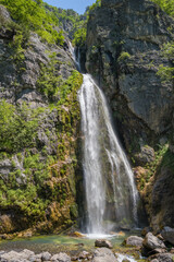 Fototapeta na wymiar Beautiful Theth waterfall near Theth village in Albanian alps mountains