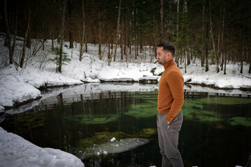 Fototapeta na wymiar Man on the forest lake. 