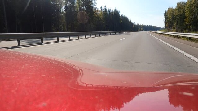 Road view on a summer day. Highways and cars, roadside and white road line markings.