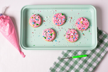 Cookies Decorated with Pink Icing and Sprinkles