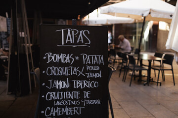 Tapas bar restaurant cafe in the historic center in Barcelona Spain. Street cafe standing banner...