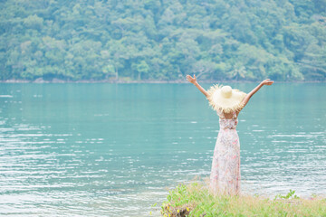 Concept of freedom happy woman  summer photo 
On natural blurred background