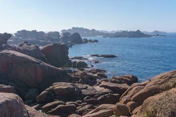 Bizarre boulders and rock formation with blue sea on the Cote de Granit Rose near Ploumanac'h,...