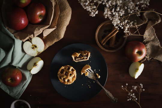 Mini Apple Pie Tarts in dark style food image