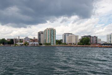 Fototapeta na wymiar waterfront city skyline on a cloudy day