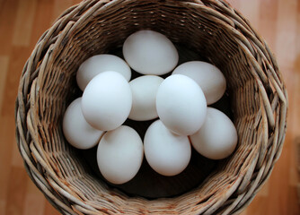 Ten Freshly Picked White Eggs Inside A Wicker Pot Top View Stock Photo