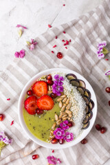 green smoothie kiwi bowl with strawberries and grains
