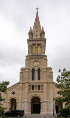 Fototapeta na wymiar Paris, France - 10 09 2022: View of old facade of the St. Joseph of Nations Parish