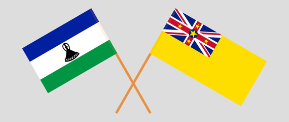 Crossed flags of Lesotho and Niue. Official colors. Correct proportion