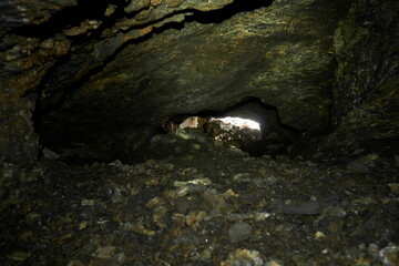 Stone vaults inside a shungite cave in Karelia