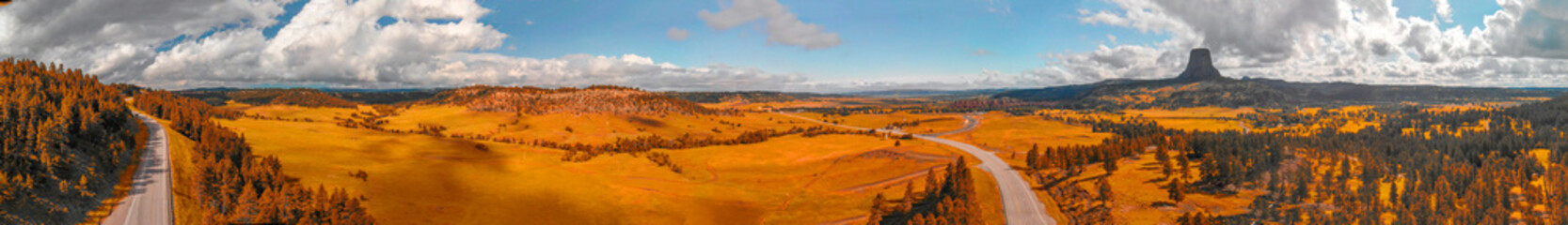 Obraz premium Aerial view of Devils Tower surrounding countryside in summer season, Wyoming