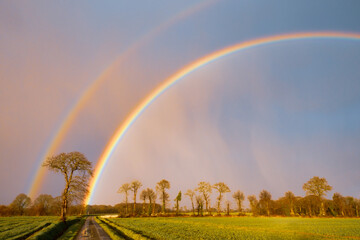 Rainbow over stormy sky in rural Brittany