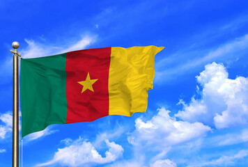 Cameroon Flag Waving In The Wind On A Beautiful Summer Blue Sky