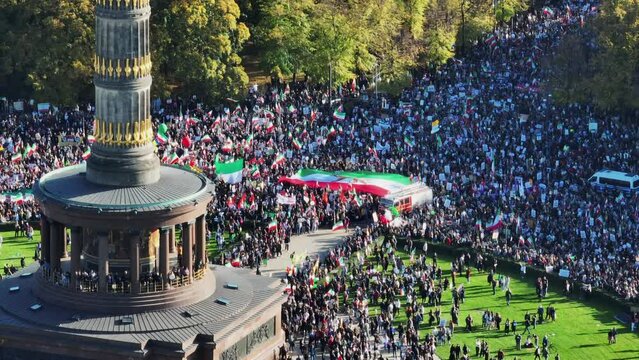 Aerial shot of crowded square and surrounding street during Iranian protest gathering against regime. Berlin, Germany