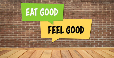 message EAT GOOD FEEL GOOD on a brick wall