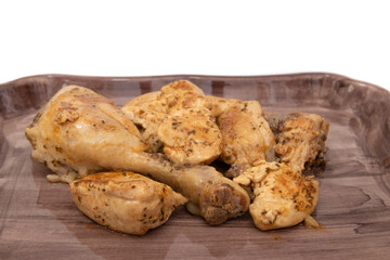 A porcelain tray with garlic chicken, on a white background. Spanish food concept.