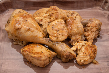 A porcelain tray with garlic chicken, chopped parsley on top. Spanish food concept.
