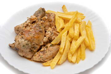 A plate of garlic chicken with pommes frites. On white background. Spanish food concept.