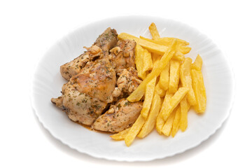 A plate of garlic chicken with pommes frites. On white background. Spanish food concept.