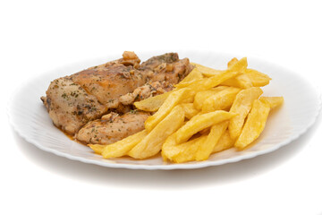 A plate of garlic chicken with pommes frites. On white background. Spanish food concept.