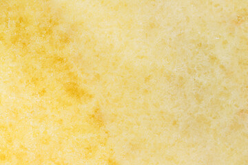 Texture of a yellow stone countertop close-up